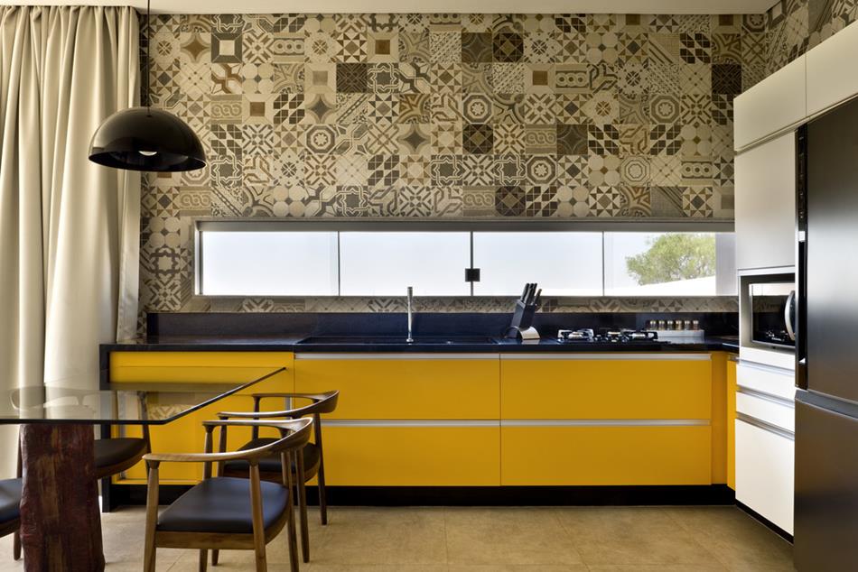 Concrete House with Bright Yellow Kitchen